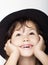 Adorable little girl in the hat closeup portrait