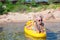 Adorable little girl kayaking during summer