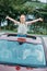 adorable little girl peering out of car