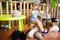 Adorable little girl playing with rabbits at the petting zoo