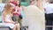 Adorable little girl with smartphone outdoors in european city near famous Fontana di Trevi