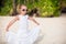 Adorable little girl on tropical beach vacation in