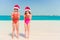 Adorable little girls on Christmas holidays on the beach