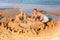 Adorable little girls playing at the seashore