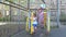 Adorable little girls swinging on a swing at a sport playground.