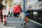 Adorable little kid boy dressed in red sweater on a railway station