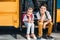 adorable little scholars sitting on stairs of