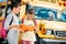 adorable little schoolgirls with notebook discussing homework in front of