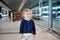 Adorable little toddler girl at the airport. Lovely child walking to the gate and going on family vacations by plane