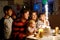 Adorable little toddler girl celebrating second birthday. Baby child, two kids boys brothers, mother and father together