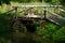 Adorable Little Twin Brothers Sitting on the Edge of Wooden Bridge and Fishing on Beautiful Lake