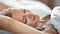 Adorable morning blonde lady perfect skin natural beauty stretching in bed with positive emotion