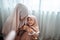 adorable muslim mother cuddling with her baby girl