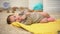 Adorable newborn baby girl on blanket, muscular development, daytime activity