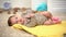 Adorable newborn baby girl on blanket, muscular development, daytime activity