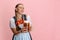 Adorable Oktoberfest woman, waitress wearing a traditional Bavarian or german dirndl holding one liter beer glass