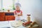 Adorable preschooler girl making cookies