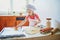 Adorable preschooler girl making cookies