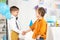 Adorable preteen boys shaking hands during birthday party.