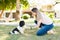 Adorable puppy learning new tricks at the park