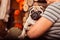 Adorable puppy pug on its owner\'s arms