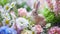 Adorable Rabbit Figurines Amidst Fresh Spring Flower Arrangements