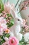 Adorable Rabbit Figurines Amidst Fresh Spring Flower Arrangements