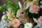 Adorable Rabbit Figurines Amidst Fresh Spring Flower Arrangements