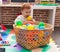 Adorable redhead toddler sucking ball sitting on floor at kindergarten