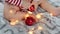 adorable santa claus baby playing with Christmas lights