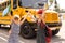 adorable schoolchildren running to school bus