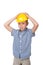 Adorable serious future builder in yellow helmet and blue checkred shirt, isolated on white background