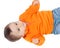 Adorable six month baby with orange jersey lying