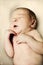 Adorable sleeping undressed newborn baby girl