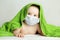 Adorable small baby in medical protective face mask