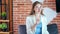 Adorable smiling business woman thinking and drinking coffee at modern loft office medium shot