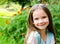 Adorable smiling little girl in summer day