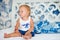 Adorable thoughtful toddler girl in bedroom