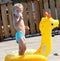 Adorable Toddler Boy eating a popsicle by the Pool