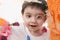 Adorable Toddler Boy Painting On Glass