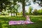 Adorable toddler girl having picnic in countryside on a summer day