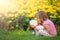 Adorable toddler girl kissing her favourite teddy bear