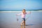 Adorable toddler girl on the sand beach at Atlantic coast of Brittany  France