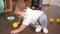 Adorable toddler smiling confident crawling on floor at home