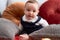 Adorable toddler smiling confident sitting on sofa at home