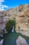 Adorable waterfall among rocks parched desert