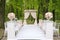 Adorable wedding archway with lined up chairs