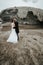 Adorable wedding couple hugging on the beach