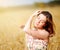 Adorable woman in field with flower