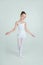 Adorable young ballerina poses on camera